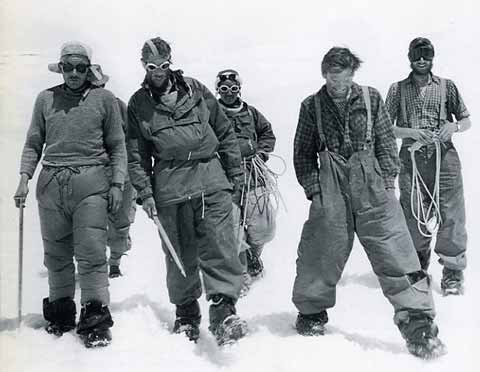 
The two 1953 Mount Everest assault parties back together at base camp. From left to right are Charles Evans, Edmund Hillary and Tenzing Norgay still roped together, Tom Bourdillon, and George Band. - Alfred Gregory's Everest book
